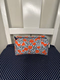 “Orange/Navy Mini Poppy” cosmetic bag